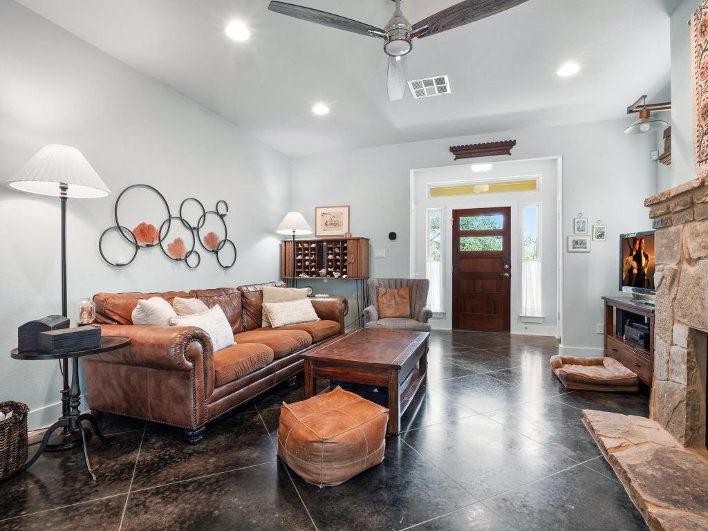 10103 Twin Lake Loop Dripping Springs, TX 78620 - Photo 9 of 32 Living area with a ceiling fan, baseboards, recessed lighting, and a fireplace