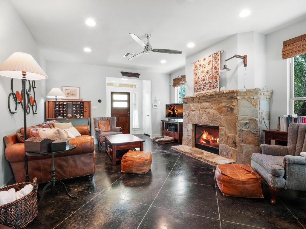 10103 Twin Lake Loop Dripping Springs, TX 78620 - Photo 10 of 32 Living room featuring recessed lighting, a stone fireplace, and ceiling fan