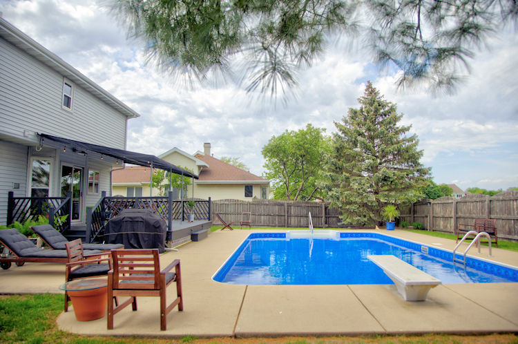 1311 Sunset Terrace Rochelle, IL 61068 - Photo 20 of 20 a swimming pool with outdoor seating and yard