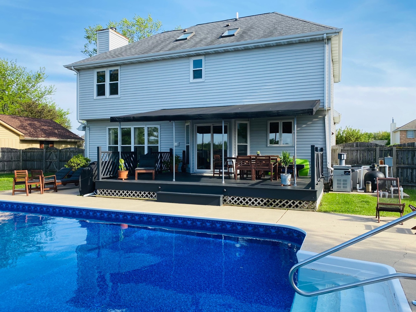 1311 Sunset Terrace Rochelle, IL 61068 - Photo 4 of 20 a view of a house with sitting area and swimming pool