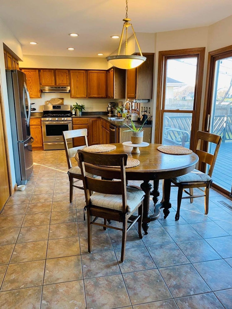 1311 Sunset Terrace Rochelle, IL 61068 - Photo 8 of 20 a view of a dining room with furniture and a chandelier