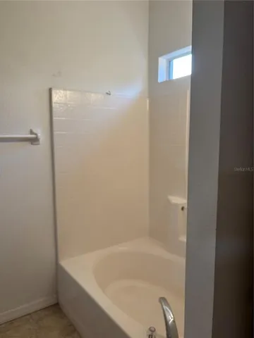 a close up of a bathtub in a bathroom