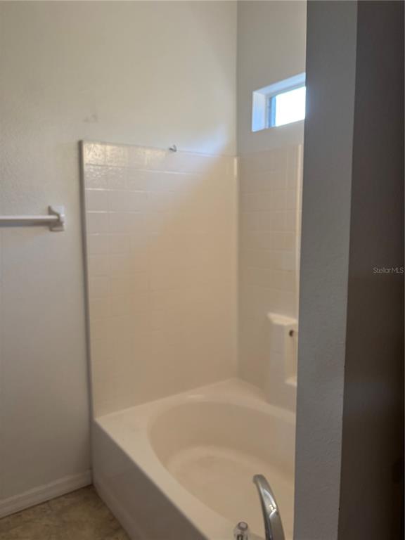 15 Zorach Place Palm Coast, FL 32164 - Photo 13 of 17 a close up of a bathtub in a bathroom