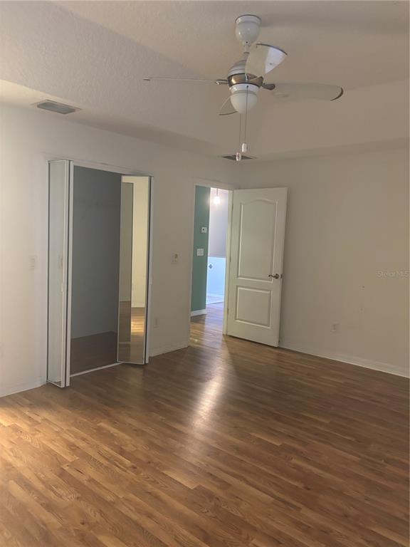 15 Zorach Place Palm Coast, FL 32164 - Photo 17 of 17 a view of an empty room with wooden floor ceiling fan