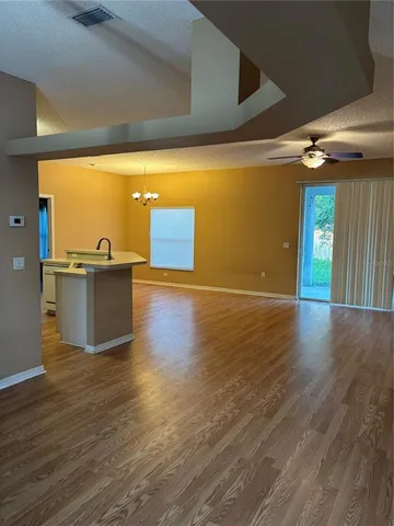 a view of a livingroom with wooden floor