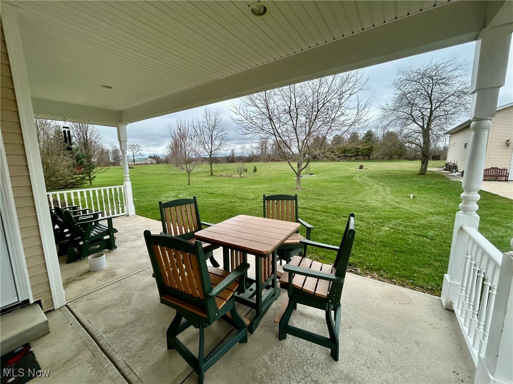 10323 Smith Road Litchfield, OH 44253 - Photo 39 of 50 View of patio / terrace featuring outdoor dining space