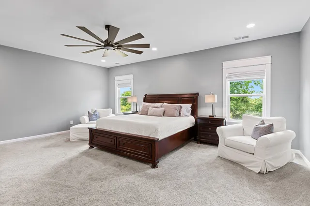 a bathroom with a tub shower and sink