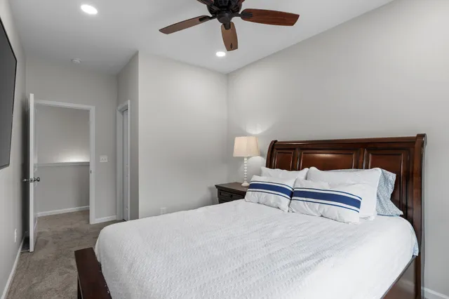 a bedroom with a bed and a television