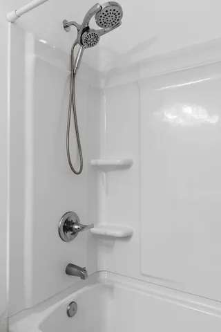 a view of storage and utility room with washer and dryer