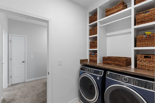 a view of a backyard with furniture and garden