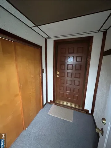 a view of hallway with wooden floor