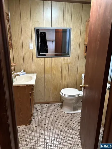 a view of a room with wooden floor and a window