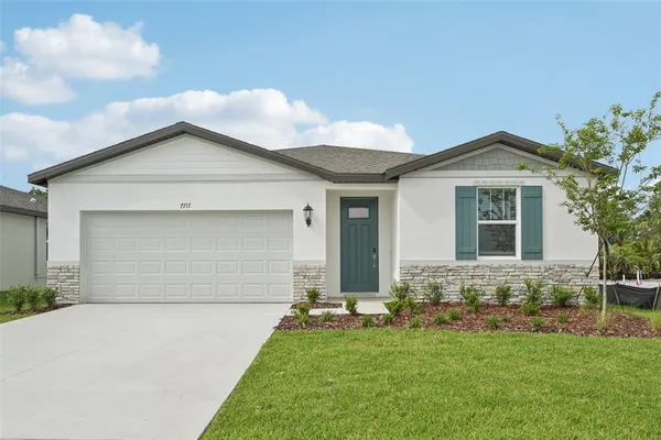 front view of a house with a yard