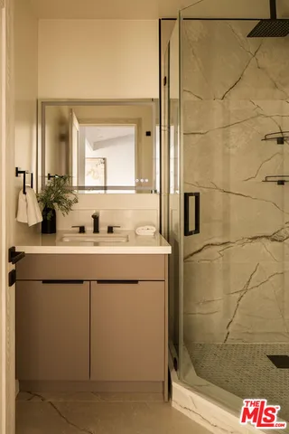 a bathroom with a sink and a mirror