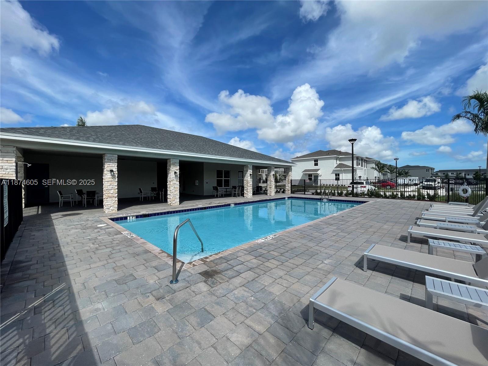 793 Southeast 19th Street Homestead, FL 33034 - Photo 5 of 13 a view of a house with swimming pool