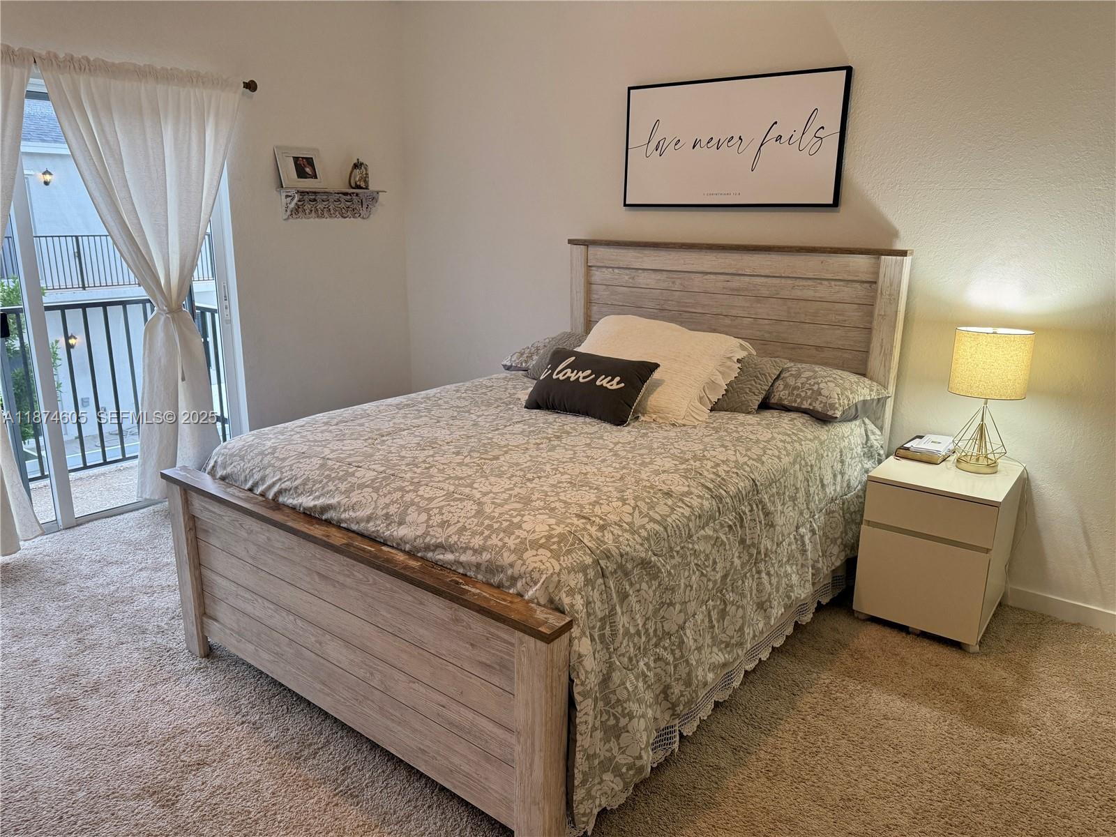 793 Southeast 19th Street Homestead, FL 33034 - Photo 8 of 13 a bedroom with a bed and a night stand