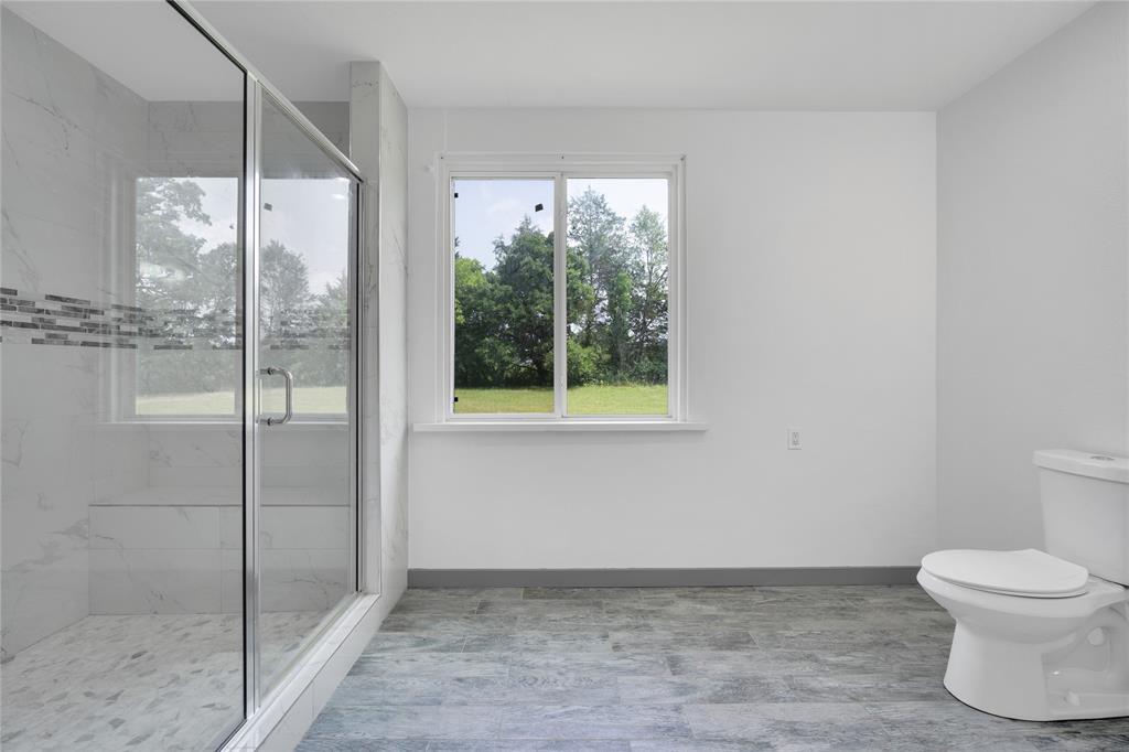 10476 County Road 313 Terrell, TX 75161 - Photo 21 of 40 a bathroom with a toilet and a shower