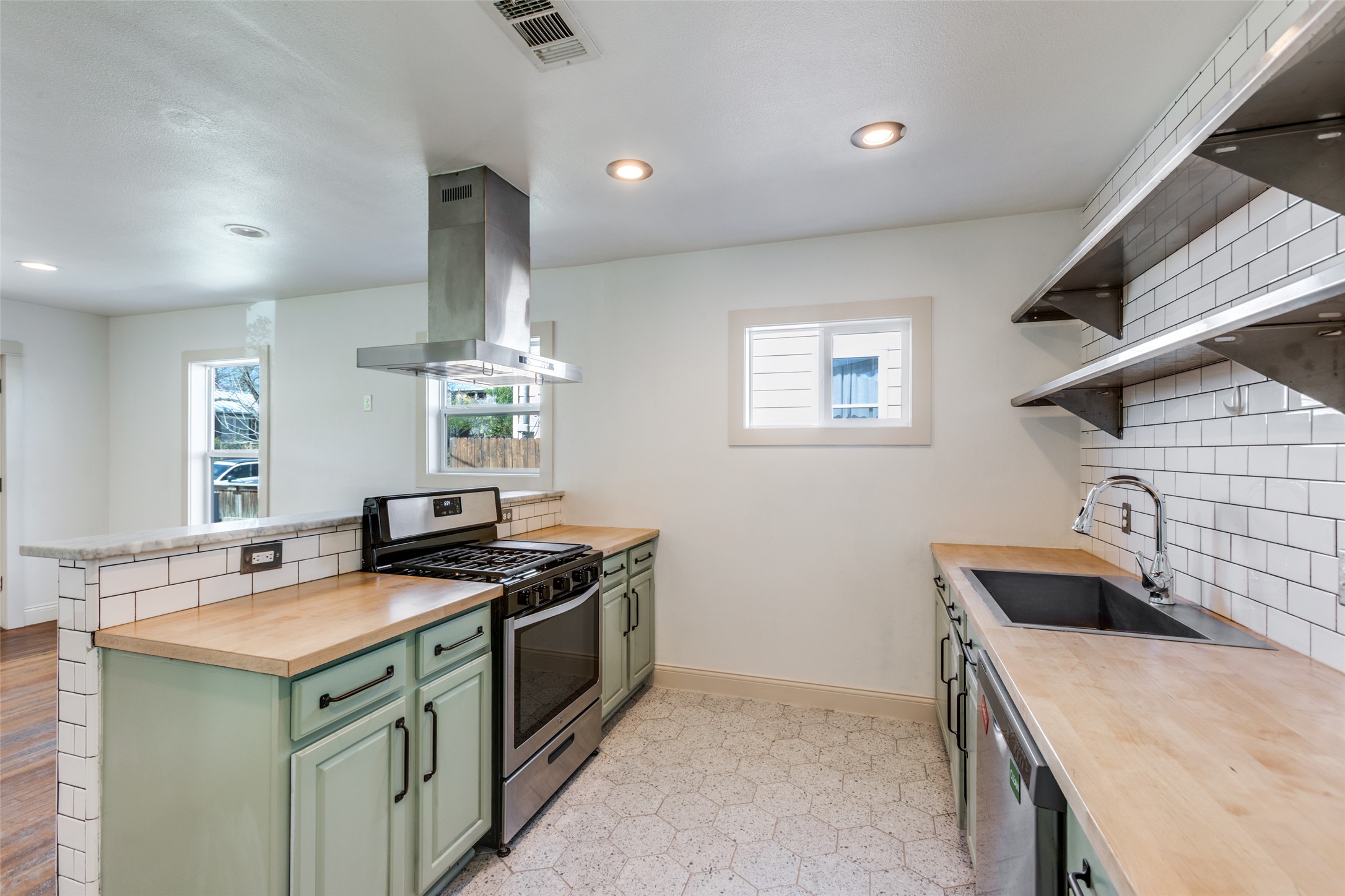 2012 Payne Avenue, Unit A Austin, TX 78757 - Photo 13 of 35 a kitchen that has a sink and a stove