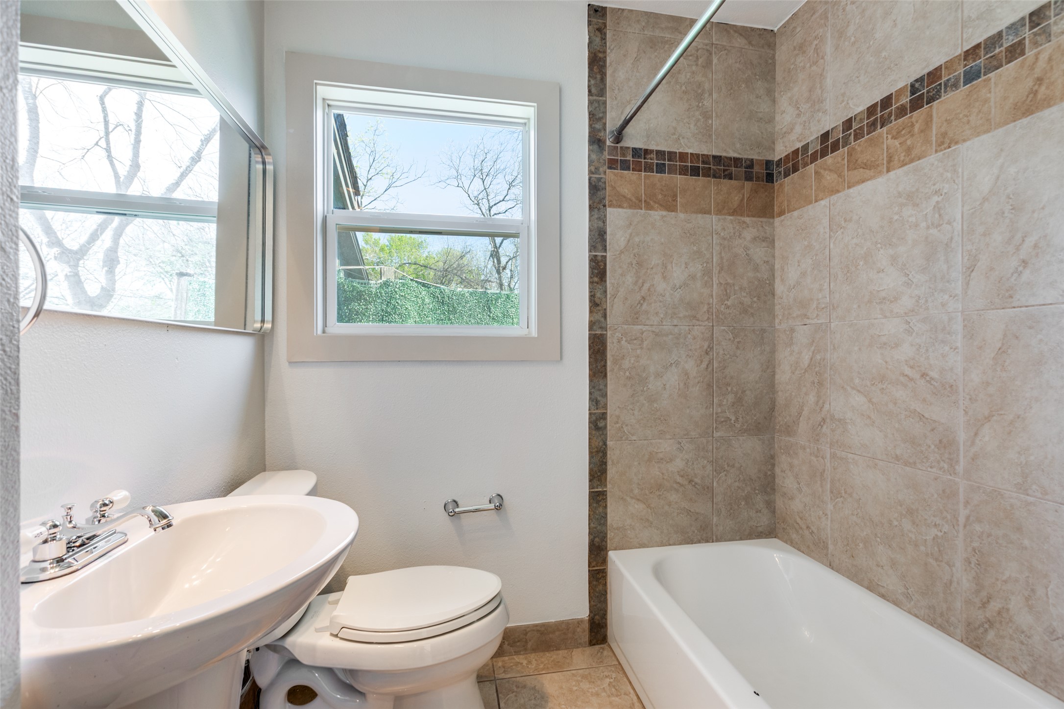 2012 Payne Avenue, Unit A Austin, TX 78757 - Photo 16 of 35 a bathroom with a sink toilet and shower