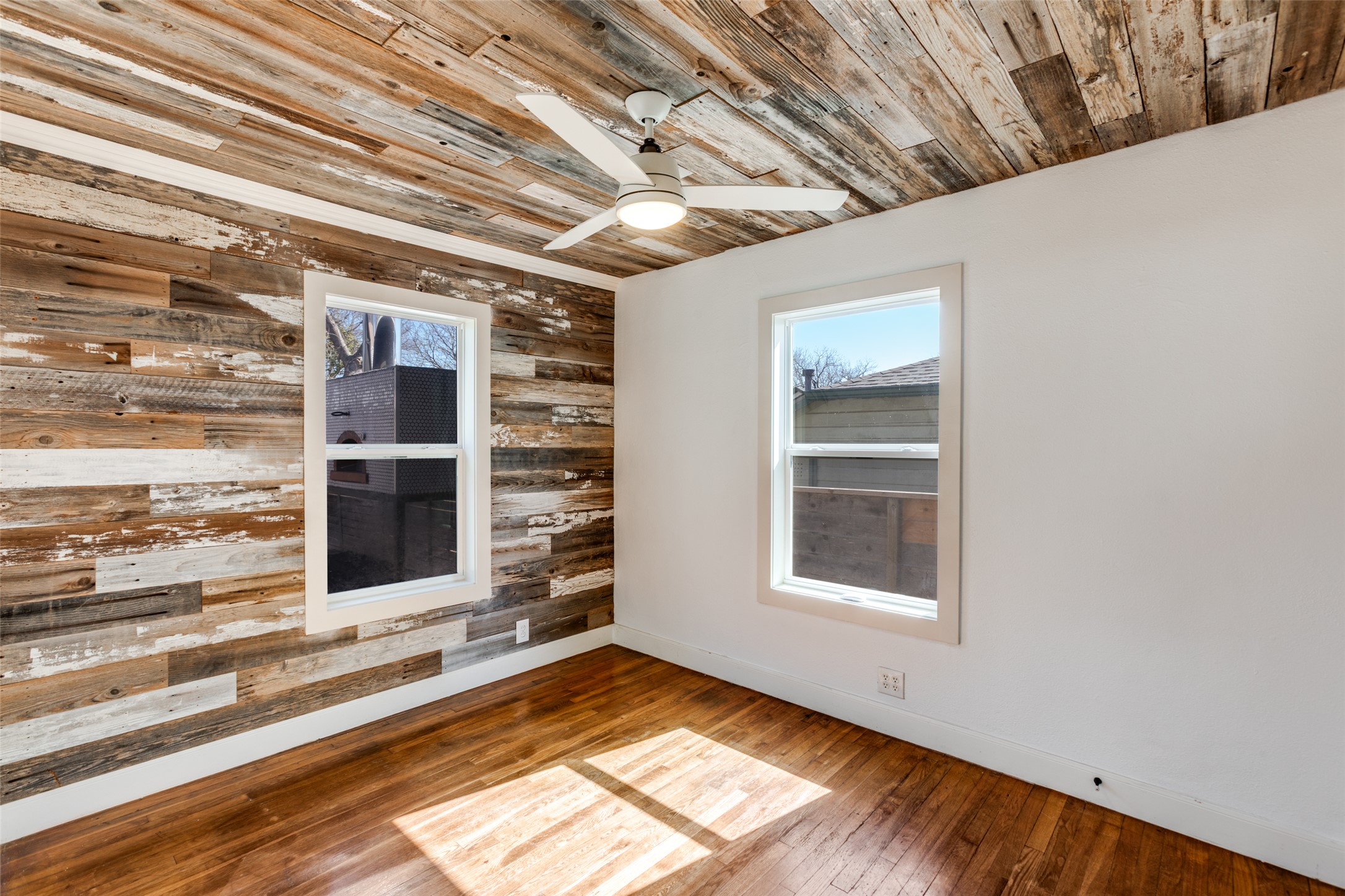 2012 Payne Avenue, Unit A Austin, TX 78757 - Photo 20 of 35 a view of an empty room with a fireplace and a window