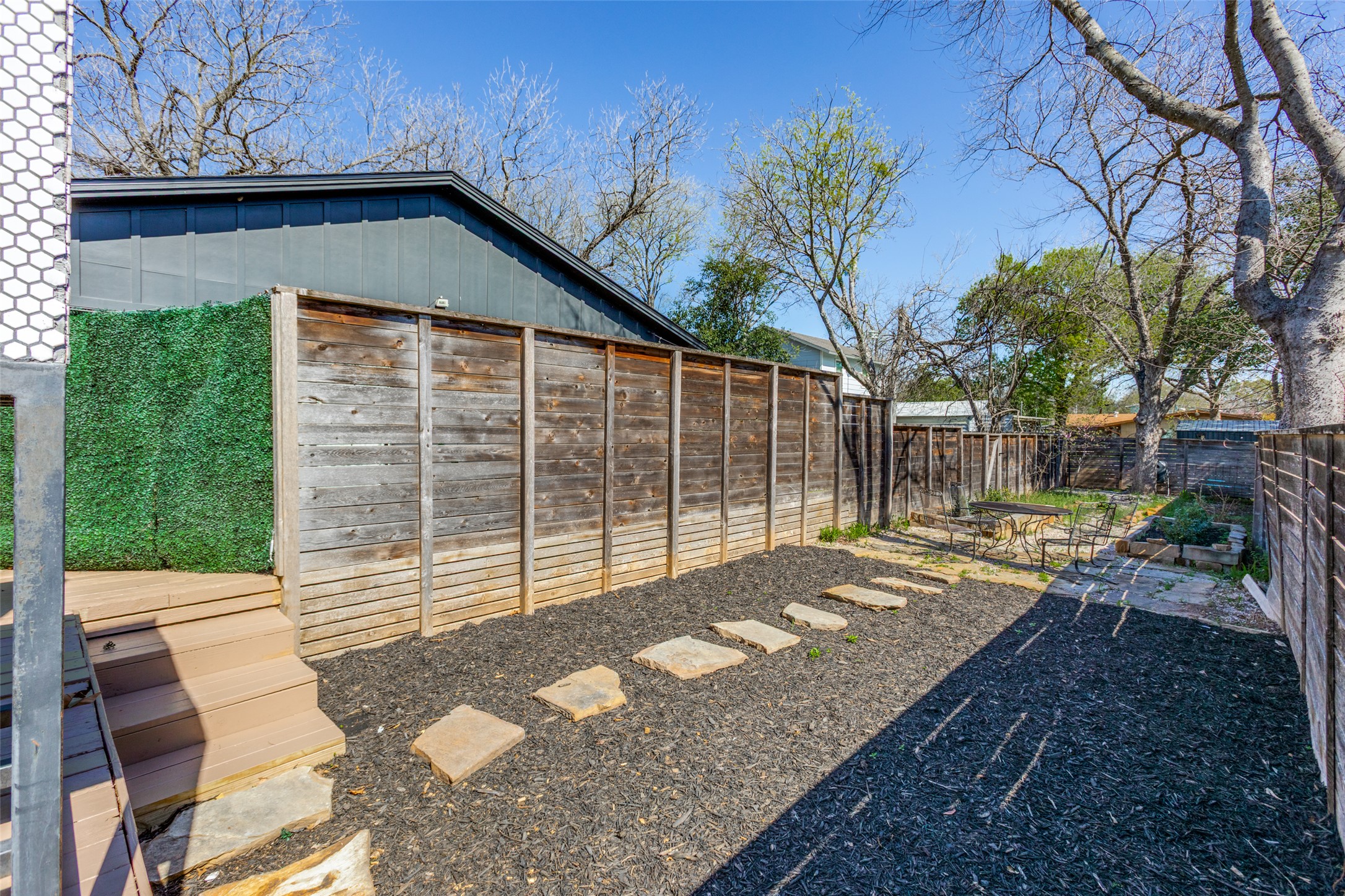 2012 Payne Avenue, Unit A Austin, TX 78757 - Photo 25 of 35 a view of backyard with wooden fence and large trees