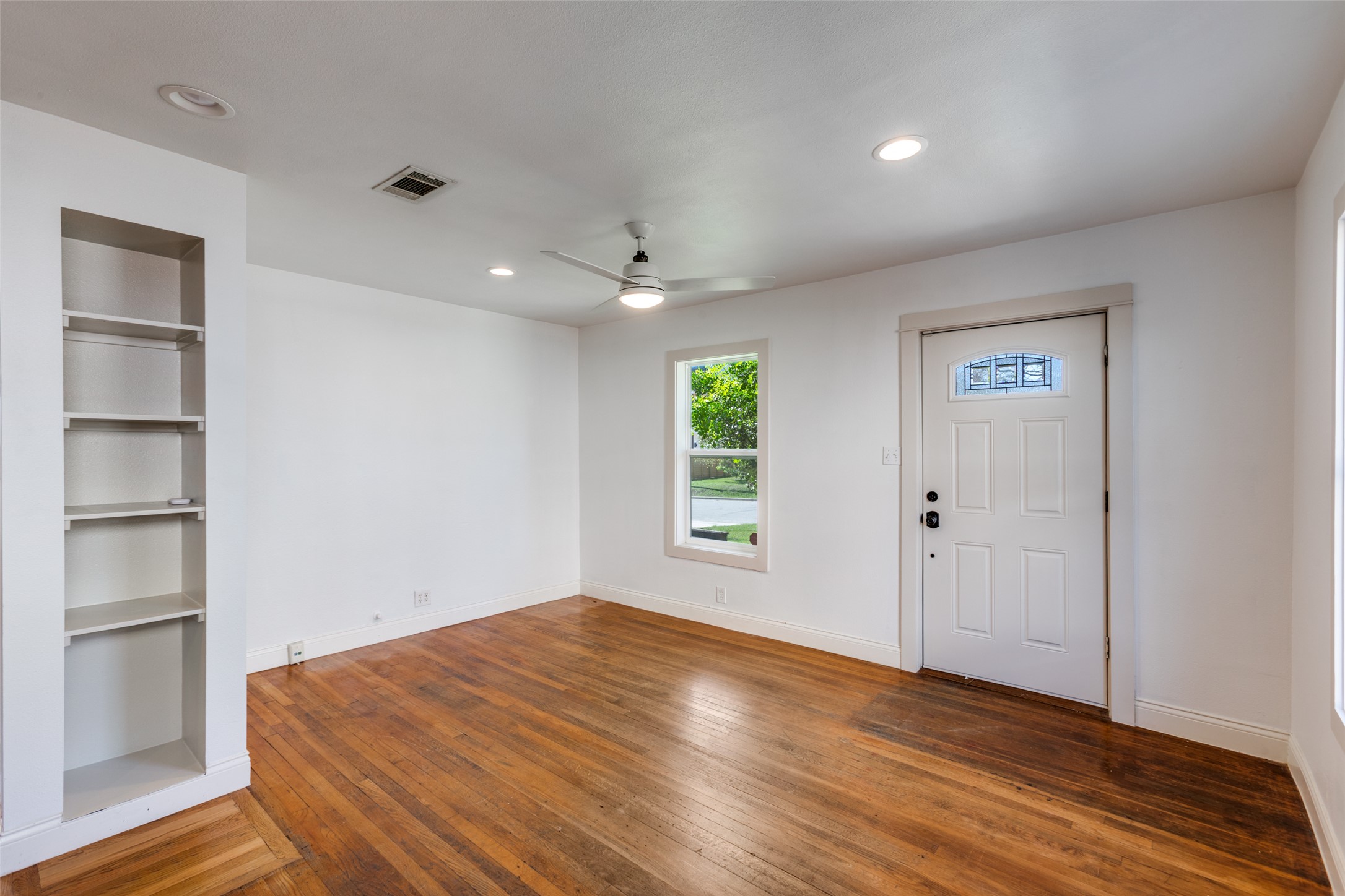 2012 Payne Avenue, Unit A Austin, TX 78757 - Photo 6 of 35 a view of empty room with wooden floor and fan