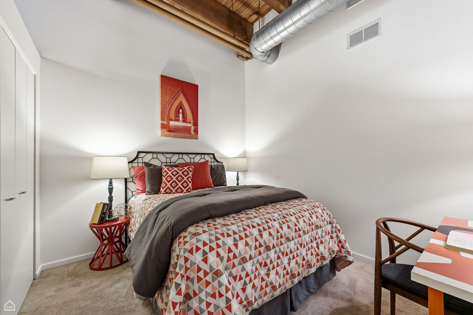 550 West Harrison Street, Unit 552 Chicago, IL 60607 - Photo 11 of 15 a bedroom with a bed and chair