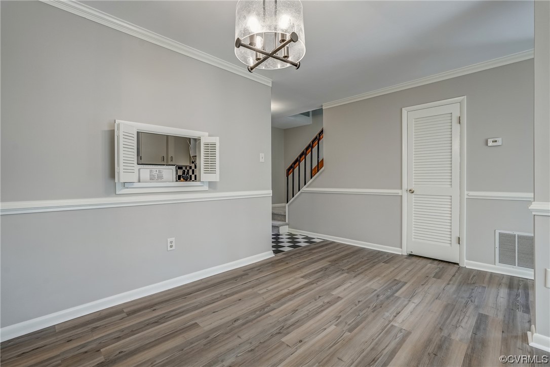 11805 South Briar Patch Drive Midlothian, VA 23113 - Photo 11 of 35 an empty room with wooden floor cabinet and windows