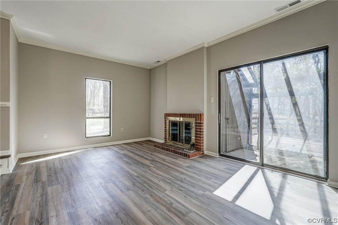 11805 South Briar Patch Drive Midlothian, VA 23113 - Photo 12 of 35 a view of an empty room with a window and wooden floor