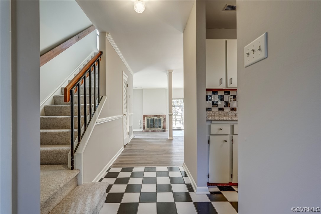 11805 South Briar Patch Drive Midlothian, VA 23113 - Photo 5 of 35 a view of a hallway with white walls and black white checkered floor