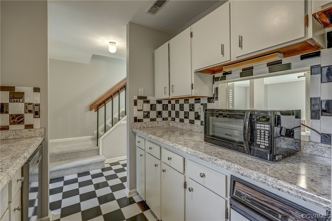 11805 South Briar Patch Drive Midlothian, VA 23113 - Photo 7 of 35 a kitchen with granite countertop a sink and a stove