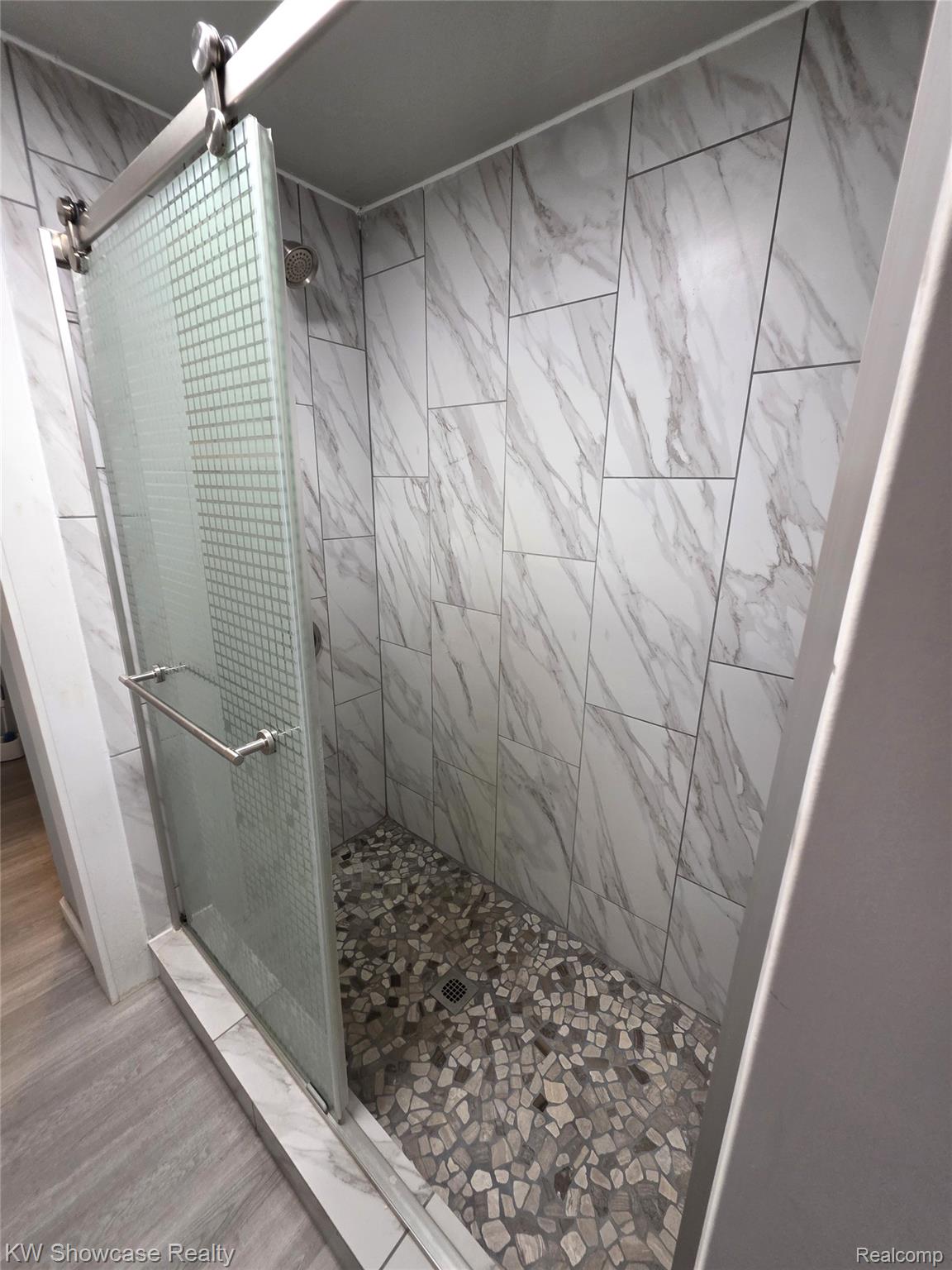 6354 Bennett Lake Road Fenton, MI 48430 - Photo 32 of 41 Full bathroom with a shower stall and light wood-type flooring