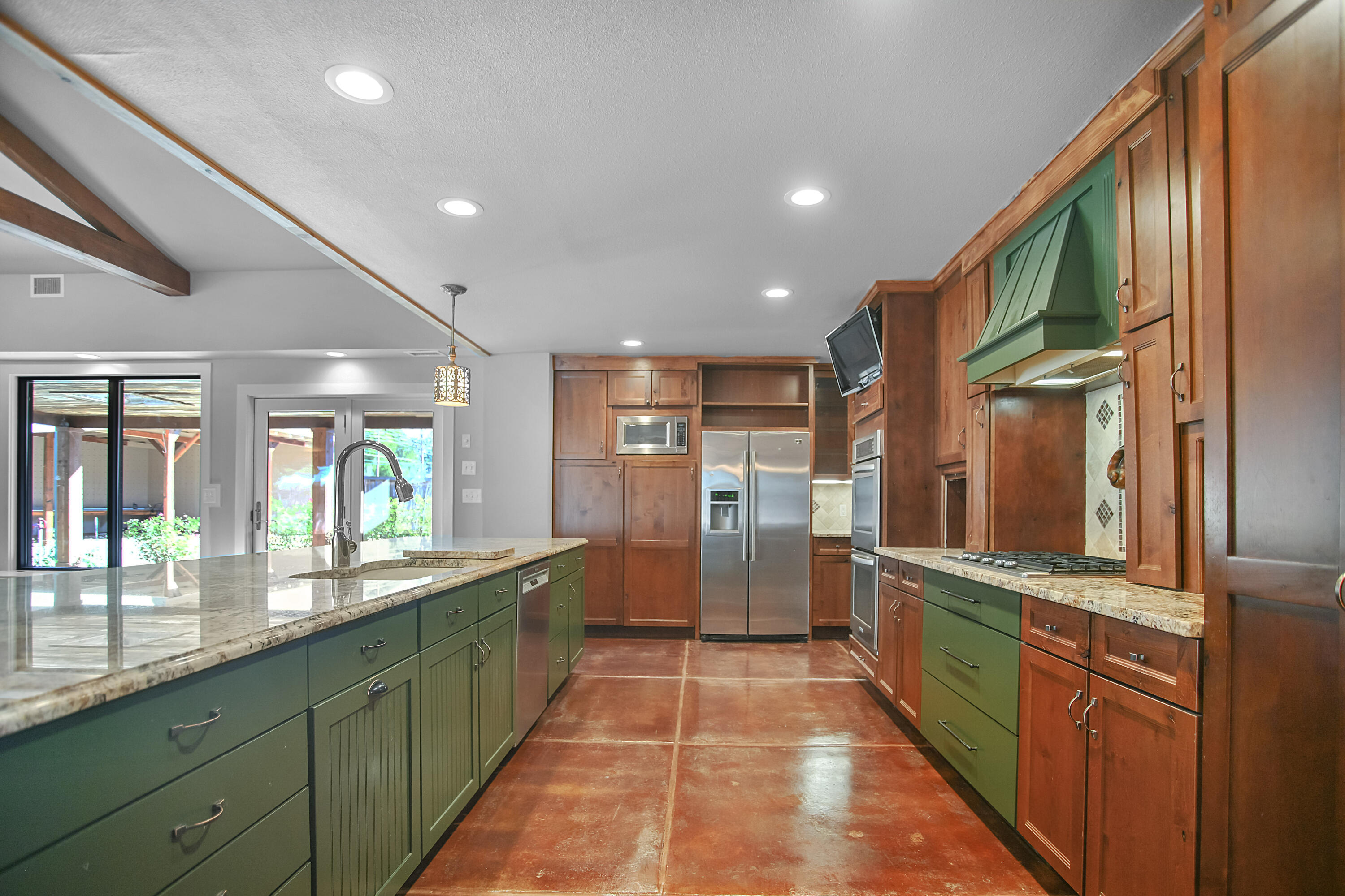 5412 20th Street Lubbock, TX 79407 - Photo 18 of 83 a large kitchen with stainless steel appliances granite countertop a large counter top a stove and a refrigerator