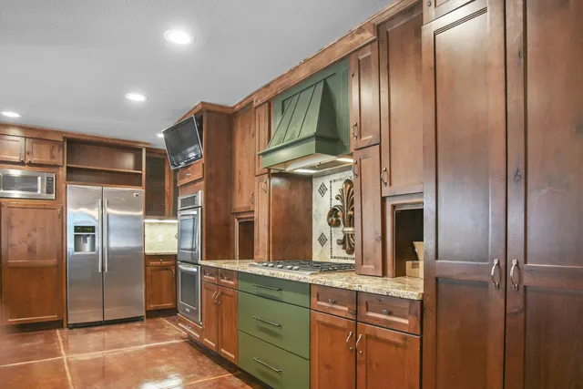 a utility room with cabinets washer and dryer