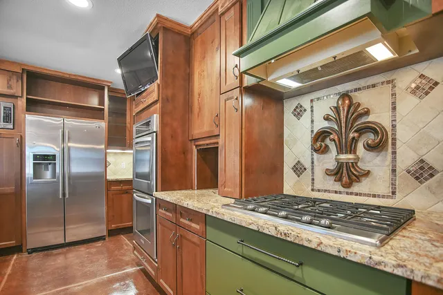 a utility room with cabinets washer and dryer