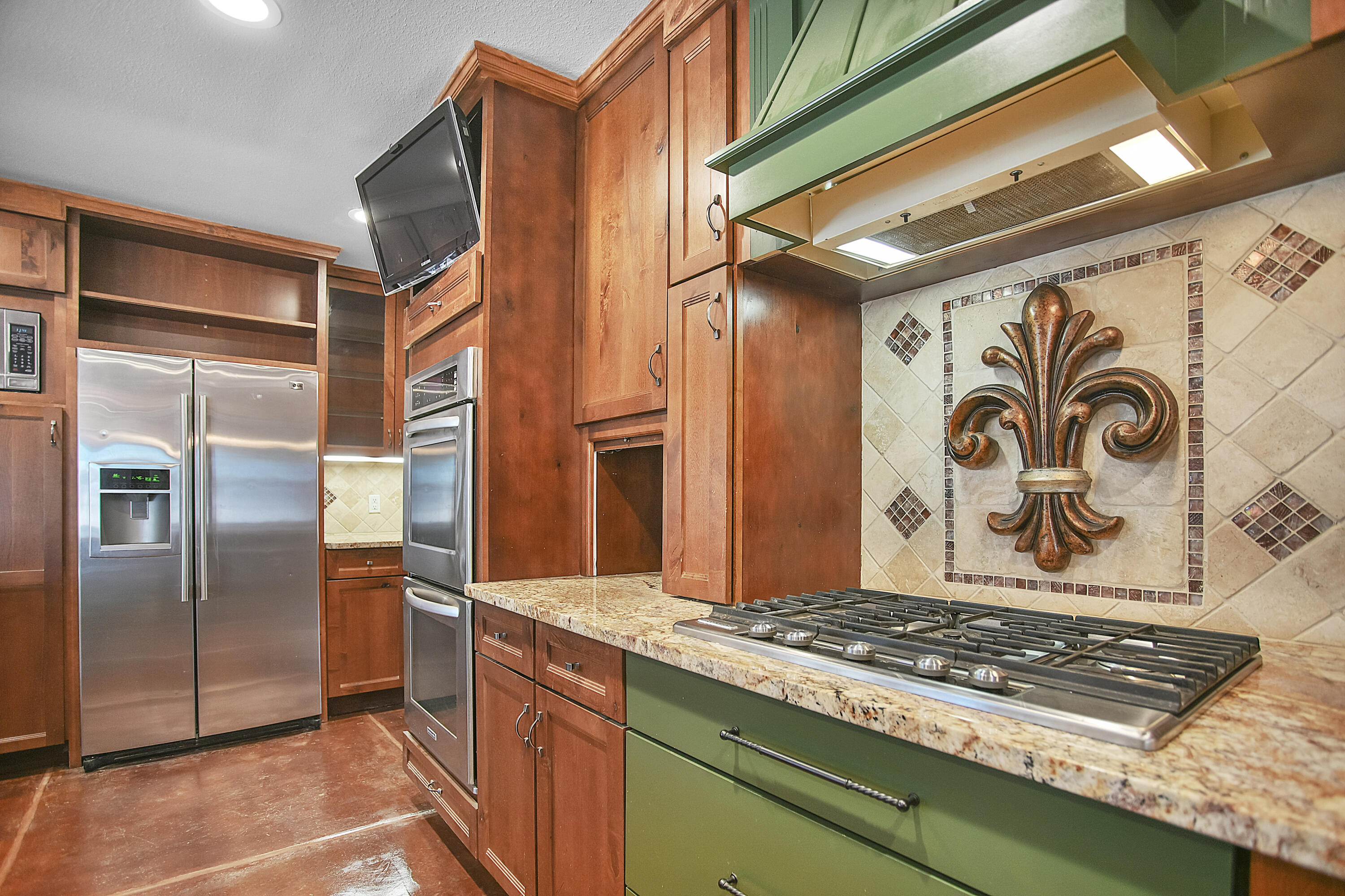 5412 20th Street Lubbock, TX 79407 - Photo 20 of 83 a kitchen with stainless steel appliances granite countertop a refrigerator and a stove