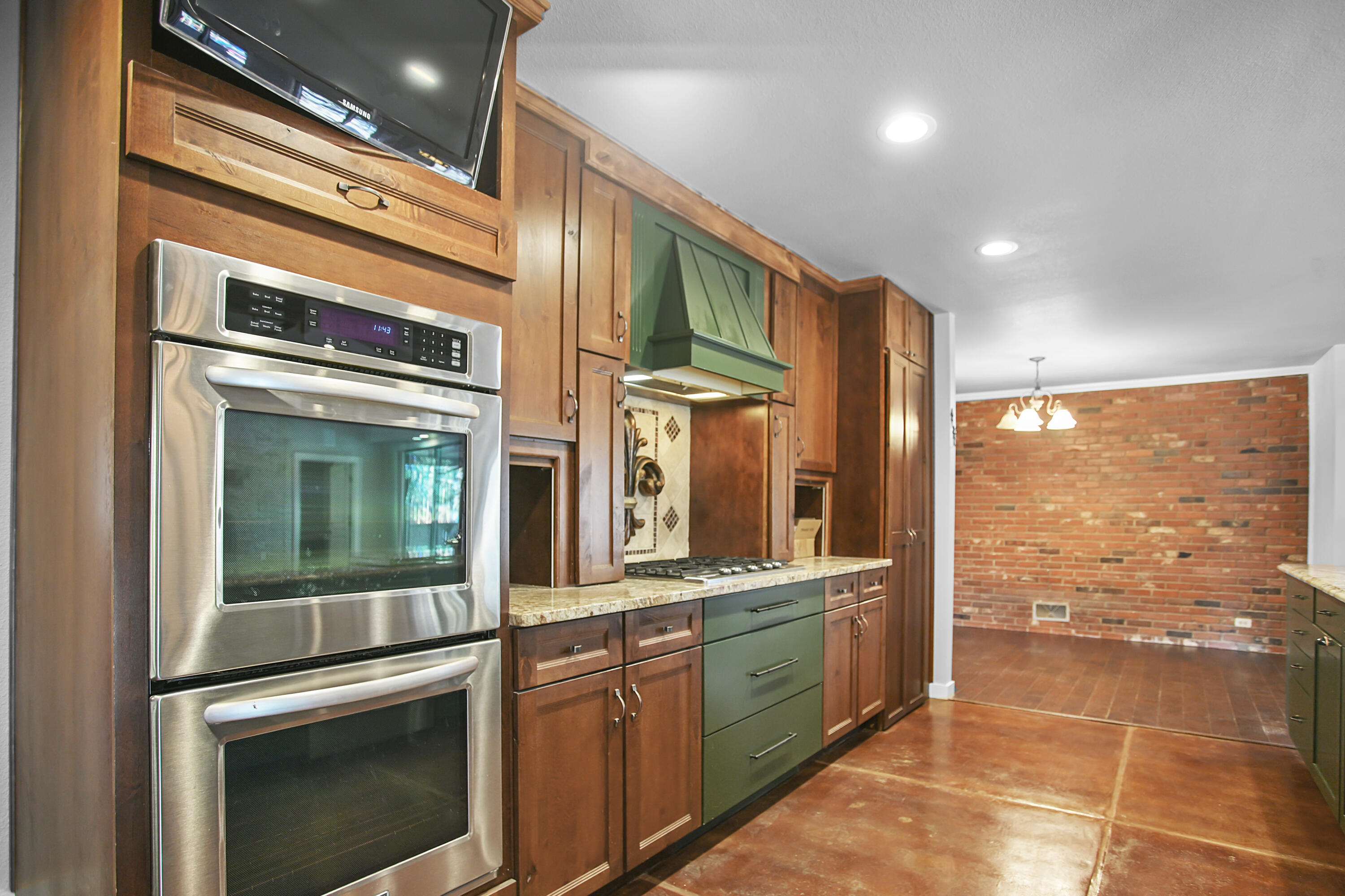 5412 20th Street Lubbock, TX 79407 - Photo 26 of 83 a kitchen with stainless steel appliances granite countertop a stove a sink and a refrigerator