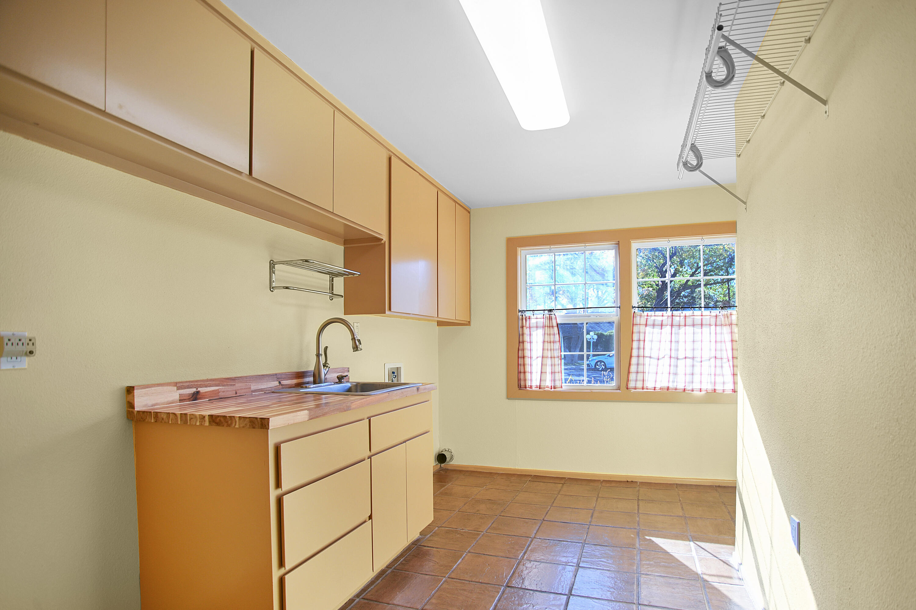 5412 20th Street Lubbock, TX 79407 - Photo 38 of 83 a utility room with cabinets washer and dryer