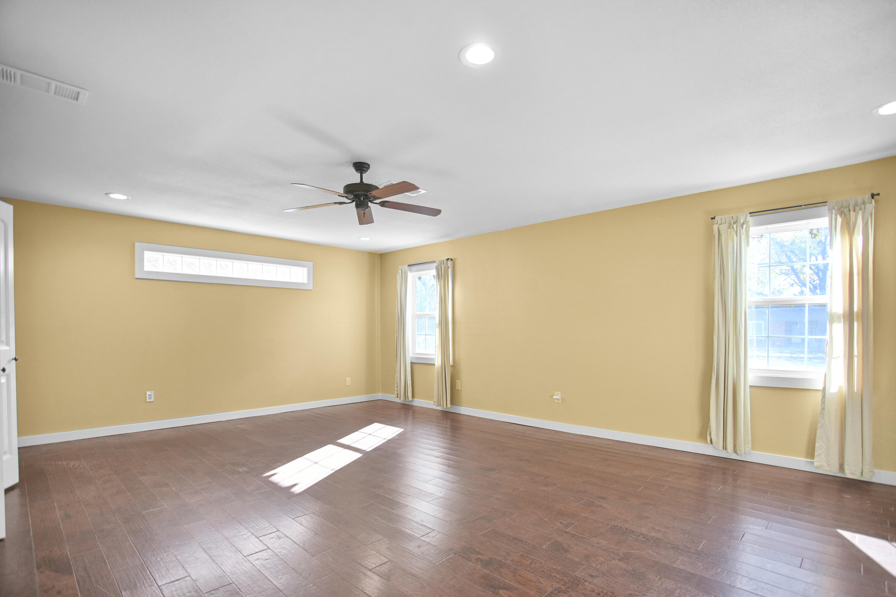 5412 20th Street Lubbock, TX 79407 - Photo 45 of 83 wooden floor in an empty room with a window