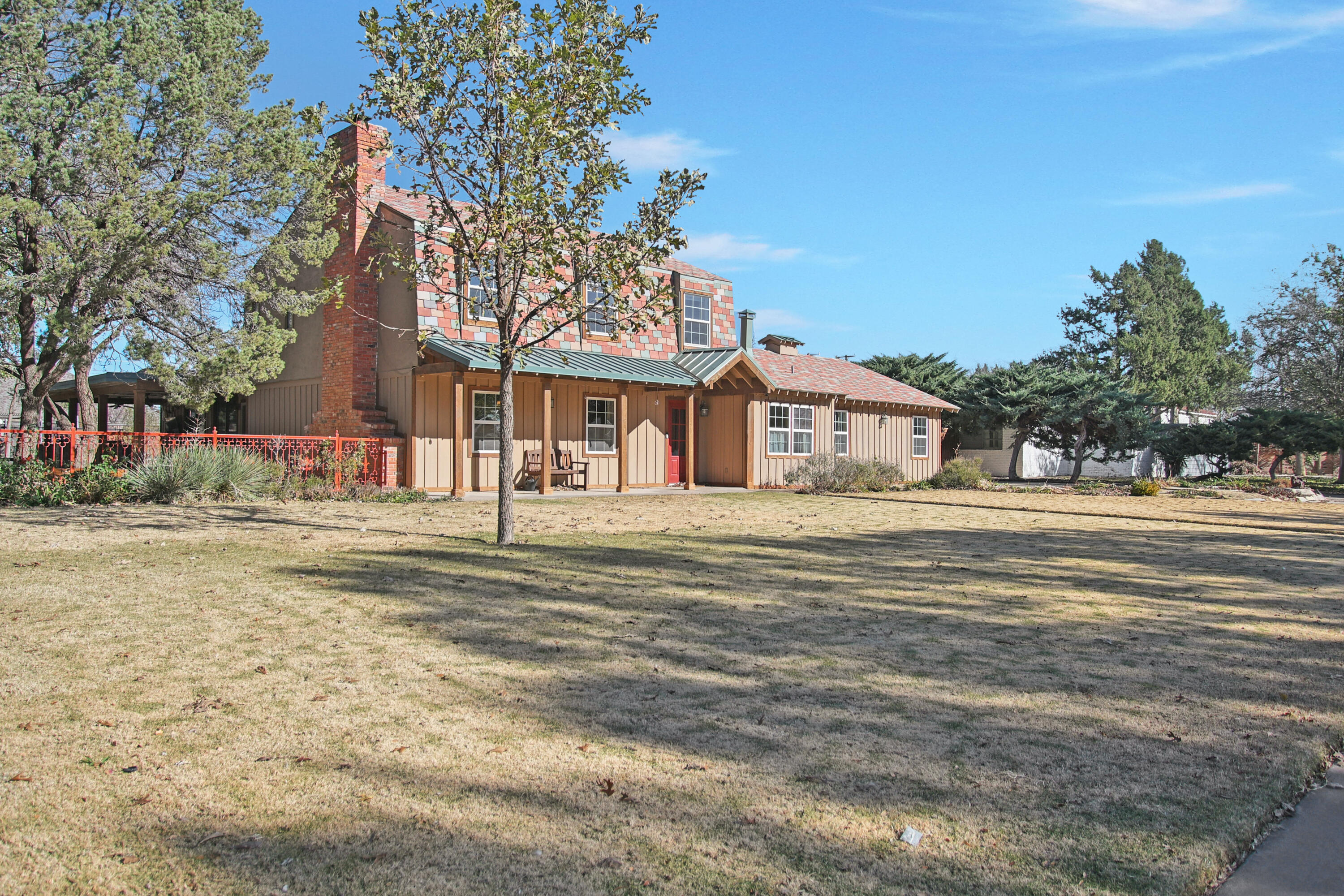 5412 20th Street Lubbock, TX 79407 - Photo 5 of 83 a front view of a house with a garden