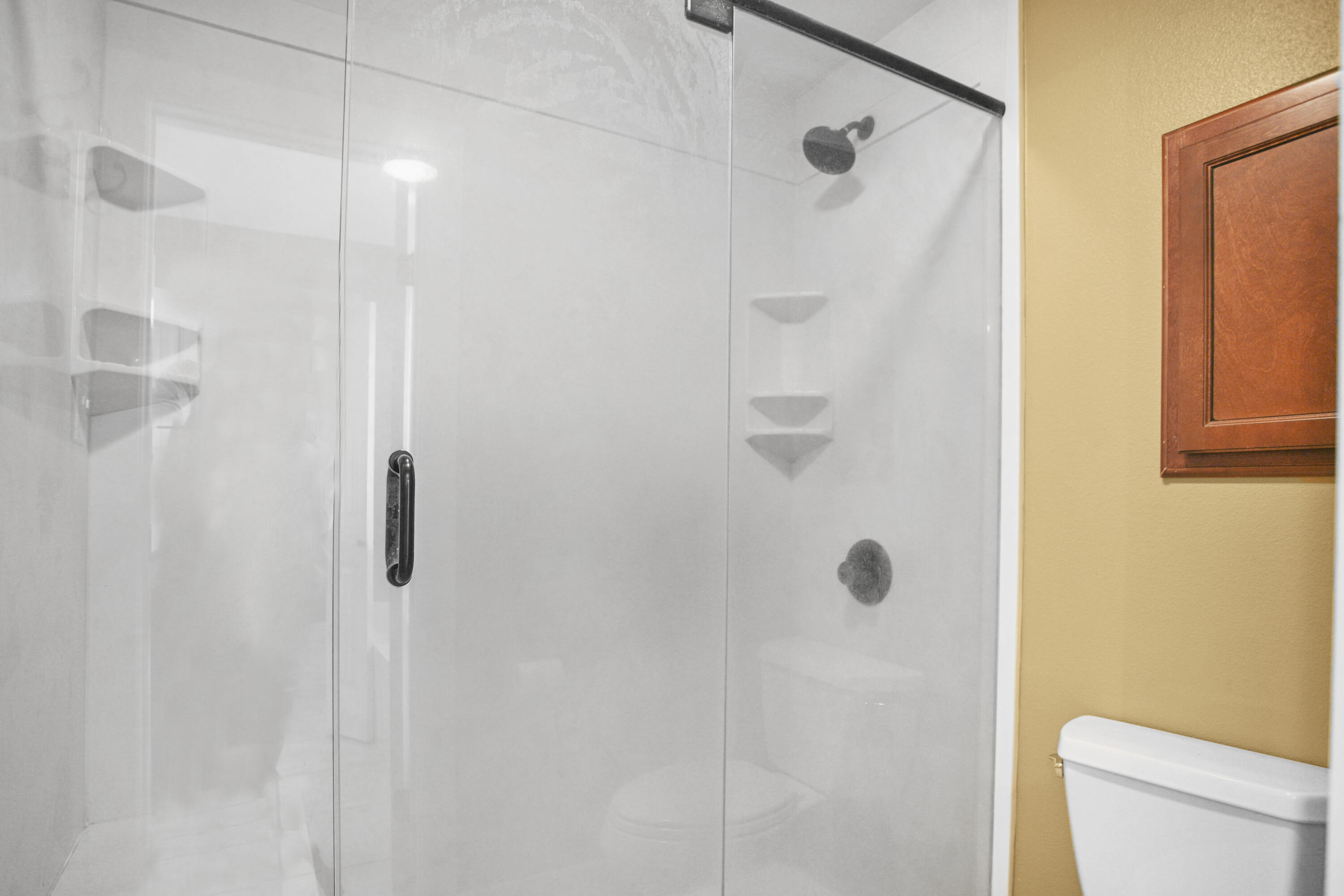 5412 20th Street Lubbock, TX 79407 - Photo 52 of 83 a bathroom with a shower and toilet