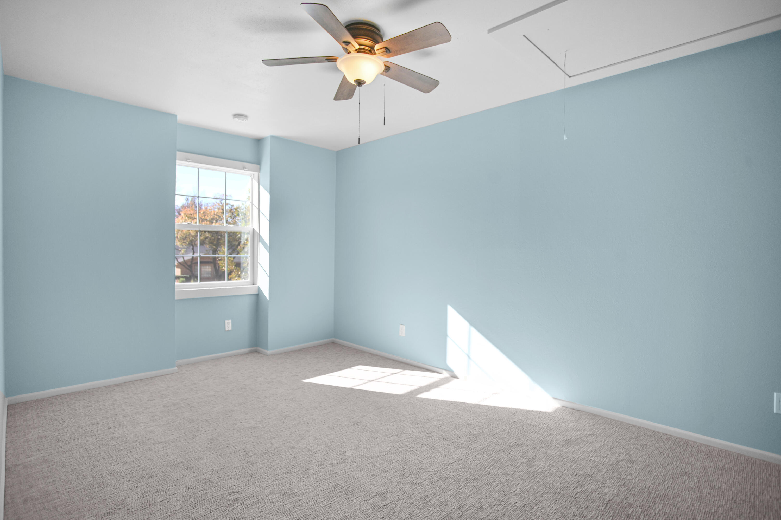 5412 20th Street Lubbock, TX 79407 - Photo 60 of 83 an empty room with windows and fan