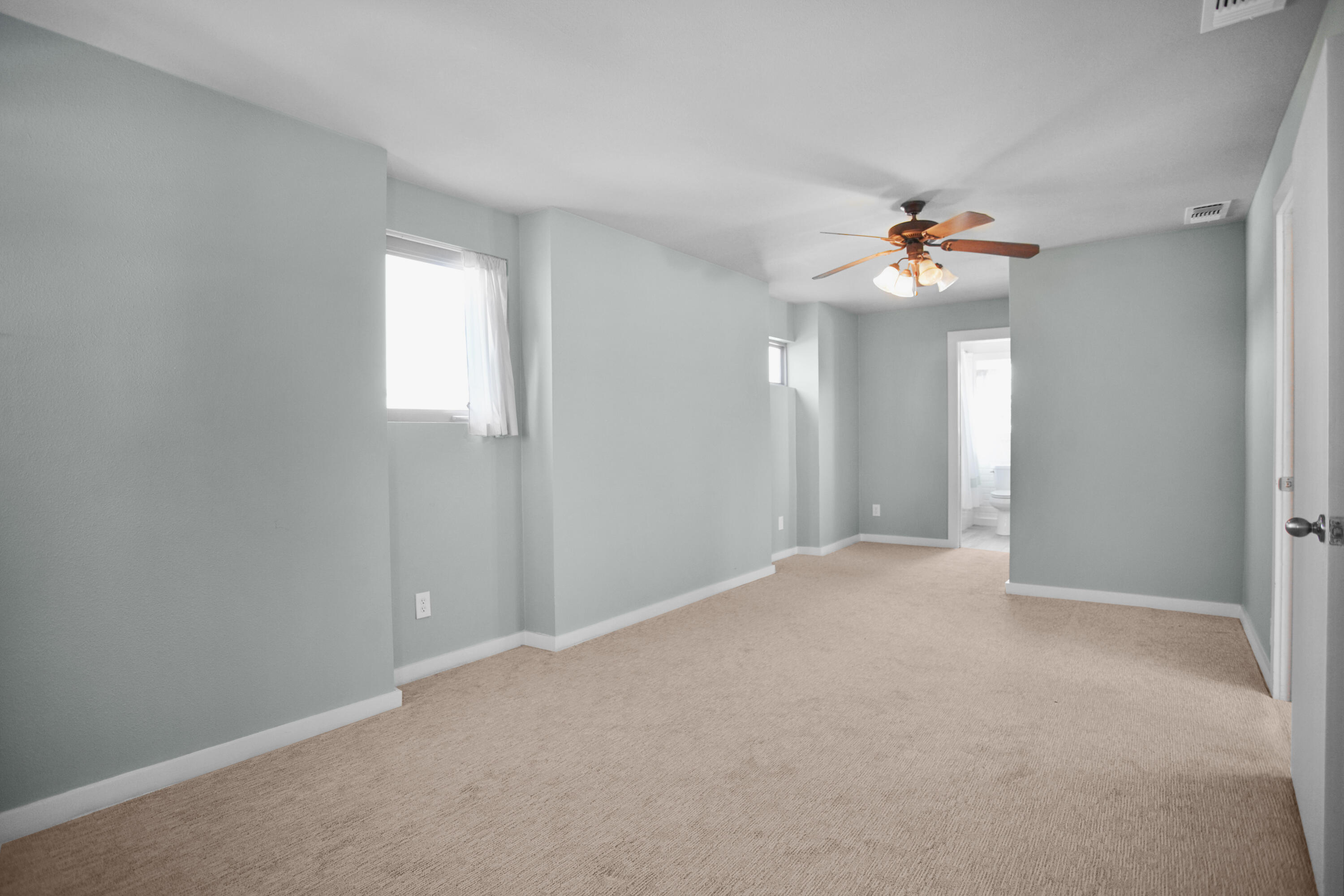 5412 20th Street Lubbock, TX 79407 - Photo 65 of 83 a view of an empty room with a chandelier fan