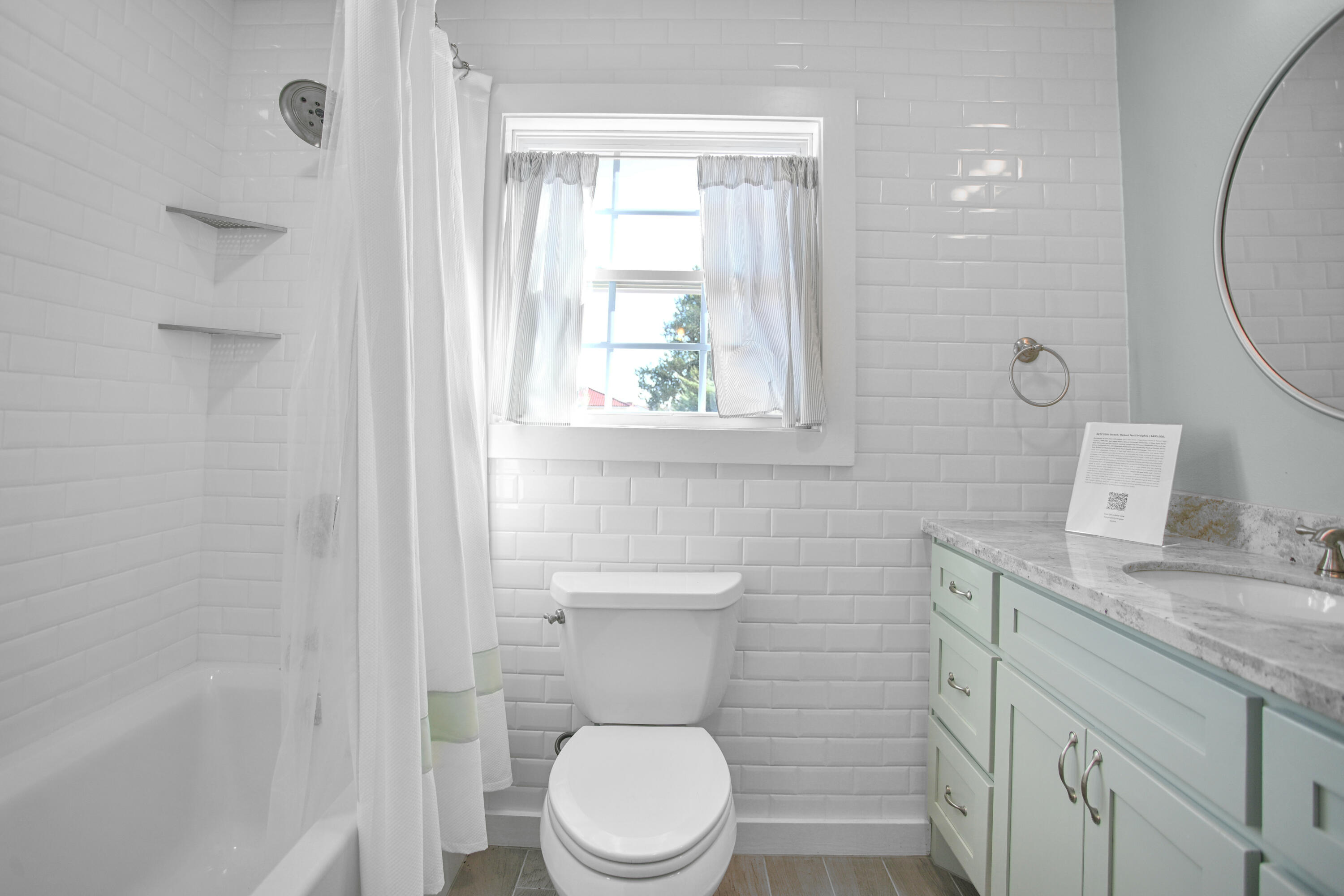 5412 20th Street Lubbock, TX 79407 - Photo 69 of 83 a white toilet sitting next to a bathroom sink