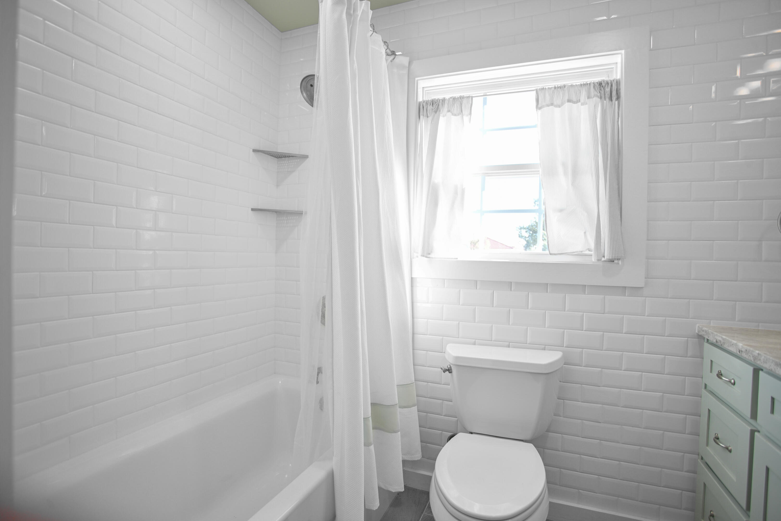 5412 20th Street Lubbock, TX 79407 - Photo 70 of 83 a bathroom with a toilet and a shower
