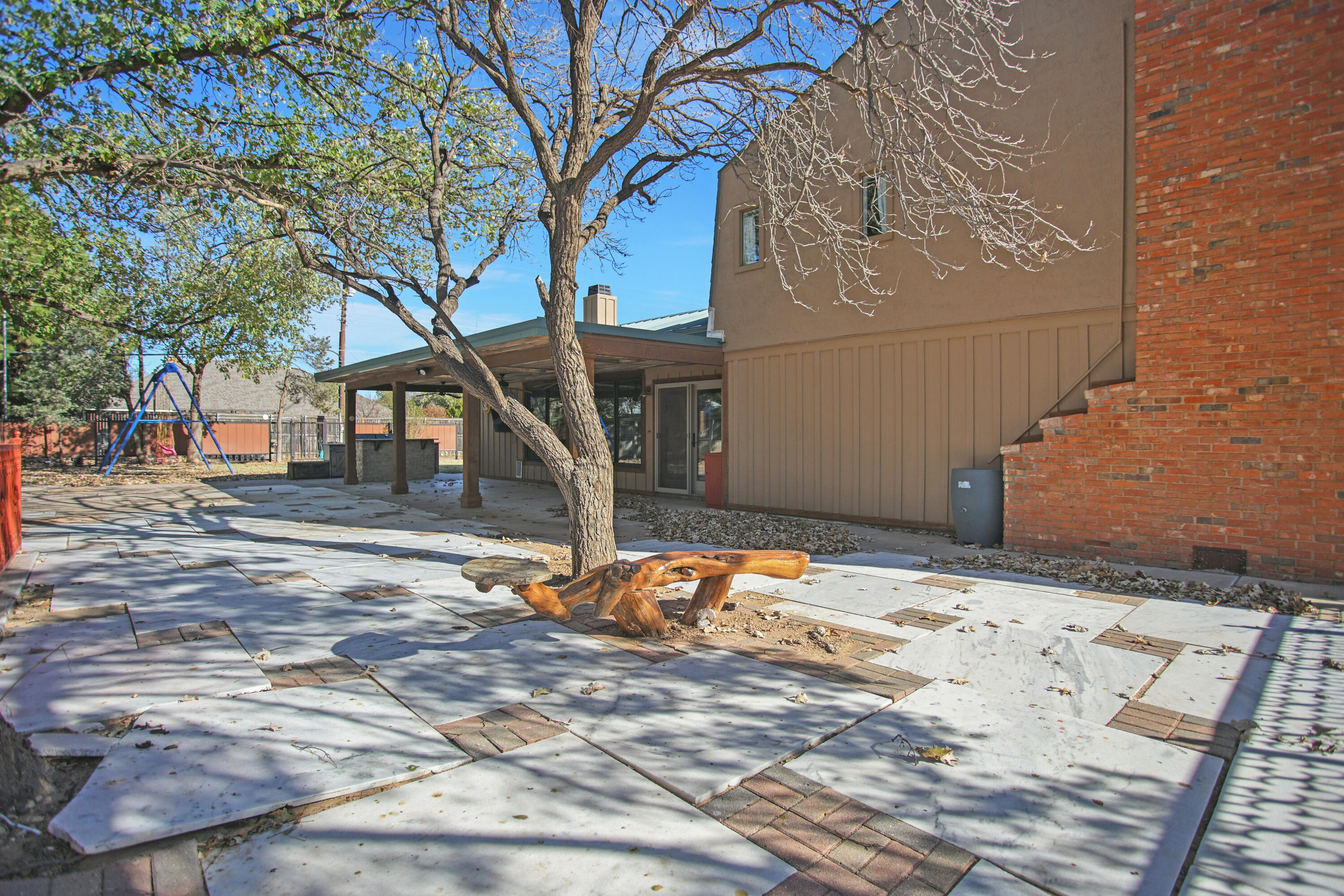 5412 20th Street Lubbock, TX 79407 - Photo 74 of 83 a backyard of a house with wooden stairs
