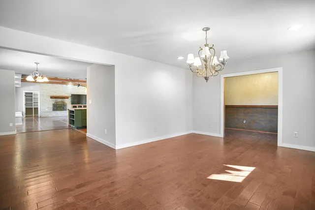 a kitchen with stainless steel appliances granite countertop a refrigerator and a stove