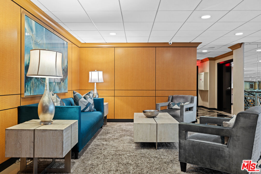 100 South Doheny Drive, Unit 512 Los Angeles, CA 90048 - Photo 36 of 37 a living room with furniture a ceiling fan and a window