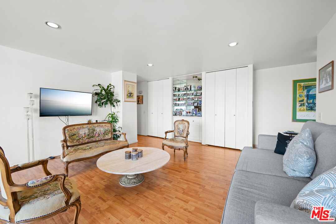 100 South Doheny Drive, Unit 512 Los Angeles, CA 90048 - Photo 8 of 37 a living room with furniture and a wooden floor