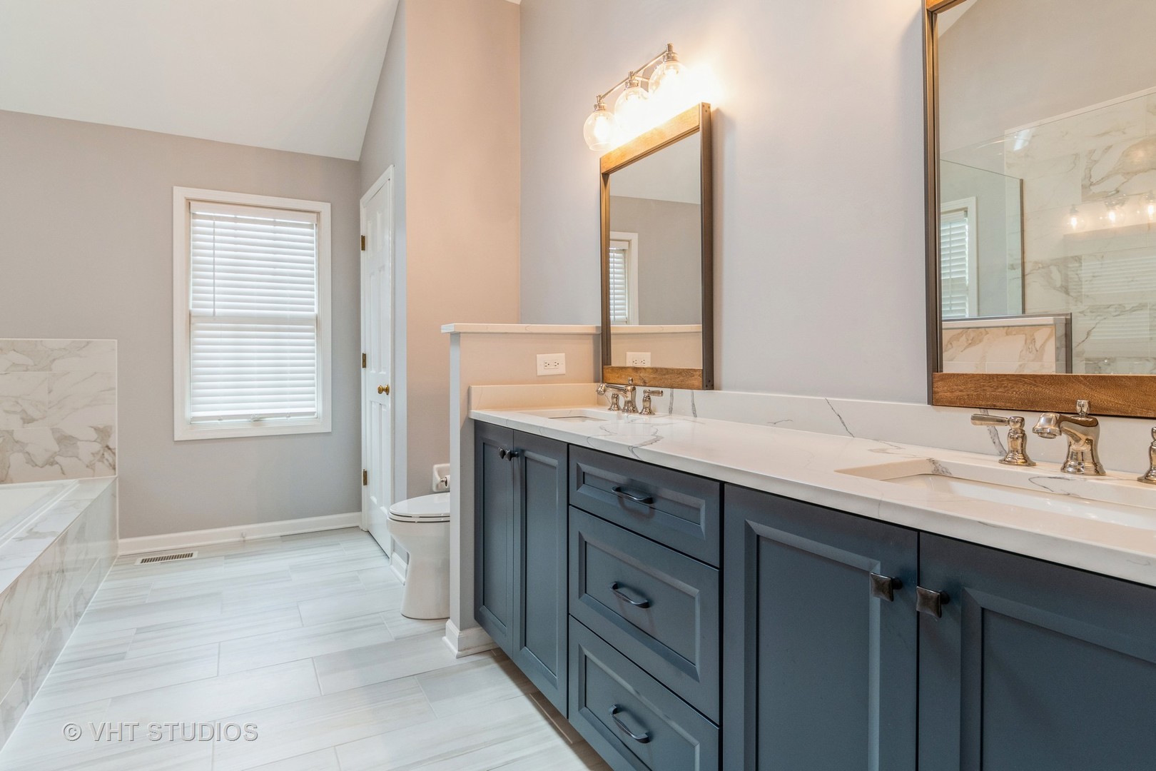 565 Boardman Circle Bolingbrook, IL 60440 - Photo 12 of 24 a bathroom with a sink double vanity and a mirror